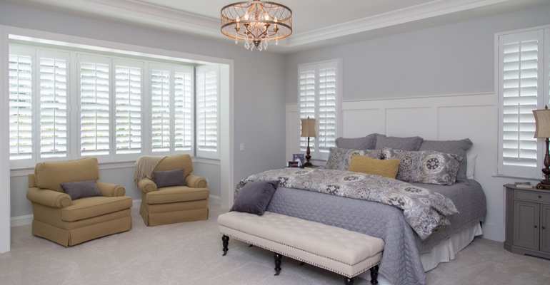 White shutters in Fort Lauderdale bedroom.